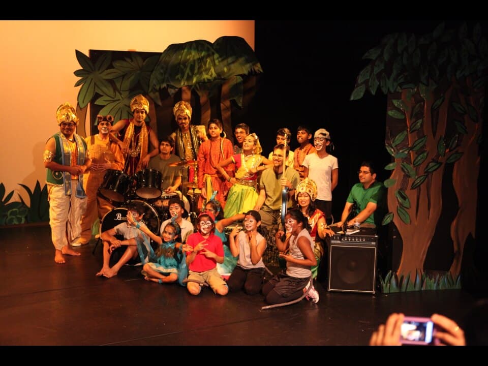 The full Shunya company, actors of every age, gathered on stage after a show